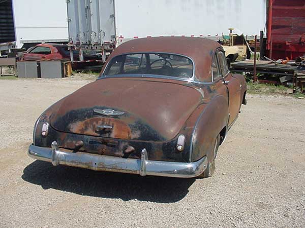 left 1949 Ford Coupe right 1949 Chevy Coupe